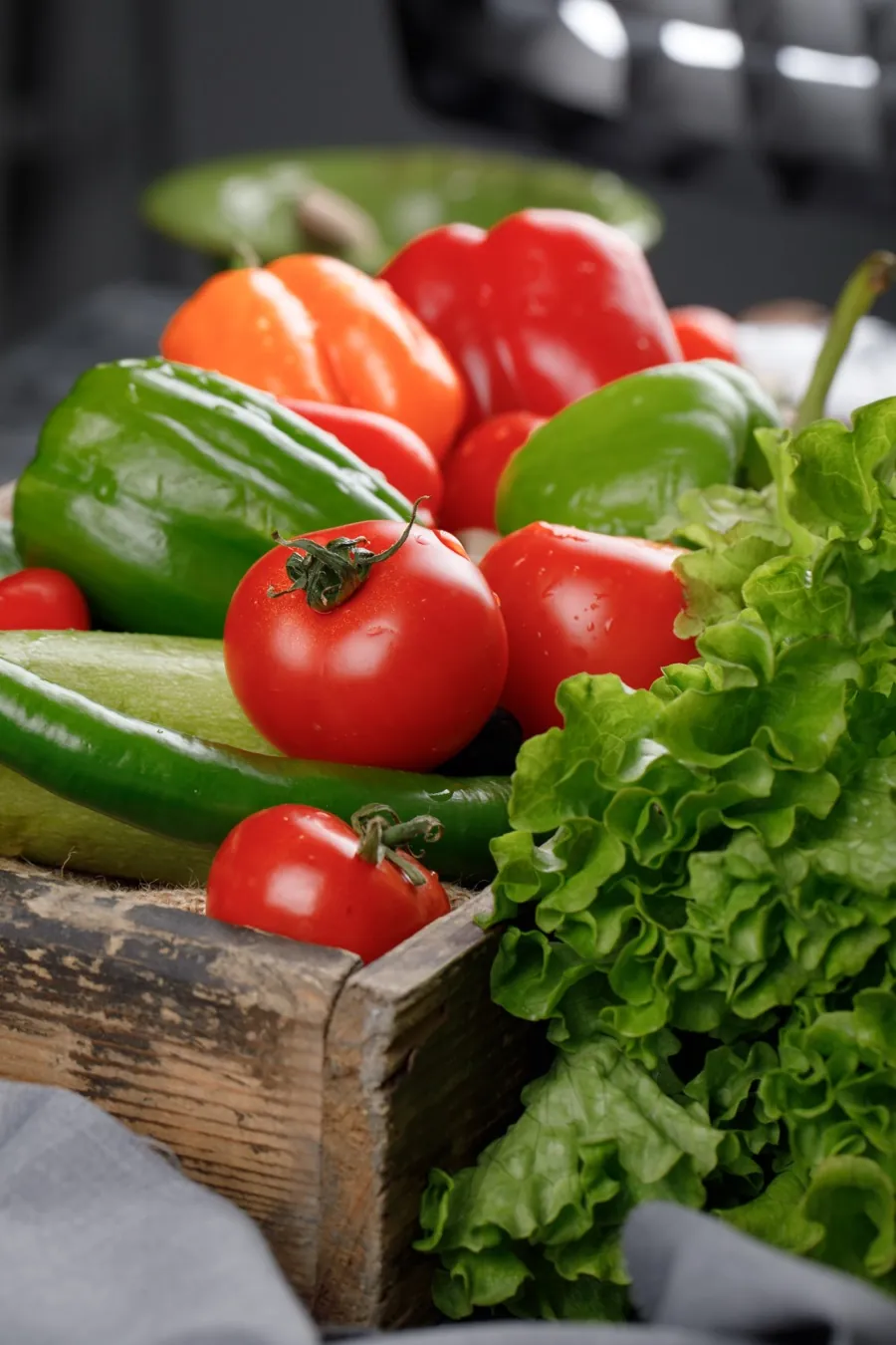 Green chilli, okra and capsicum in crates