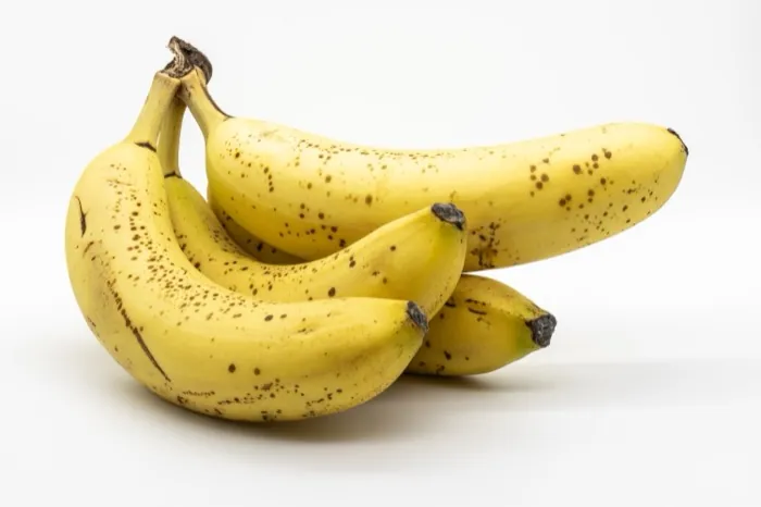 Ripe yellow bananas in a small bunch